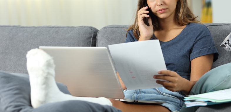 woman on the phone reviewing documentation